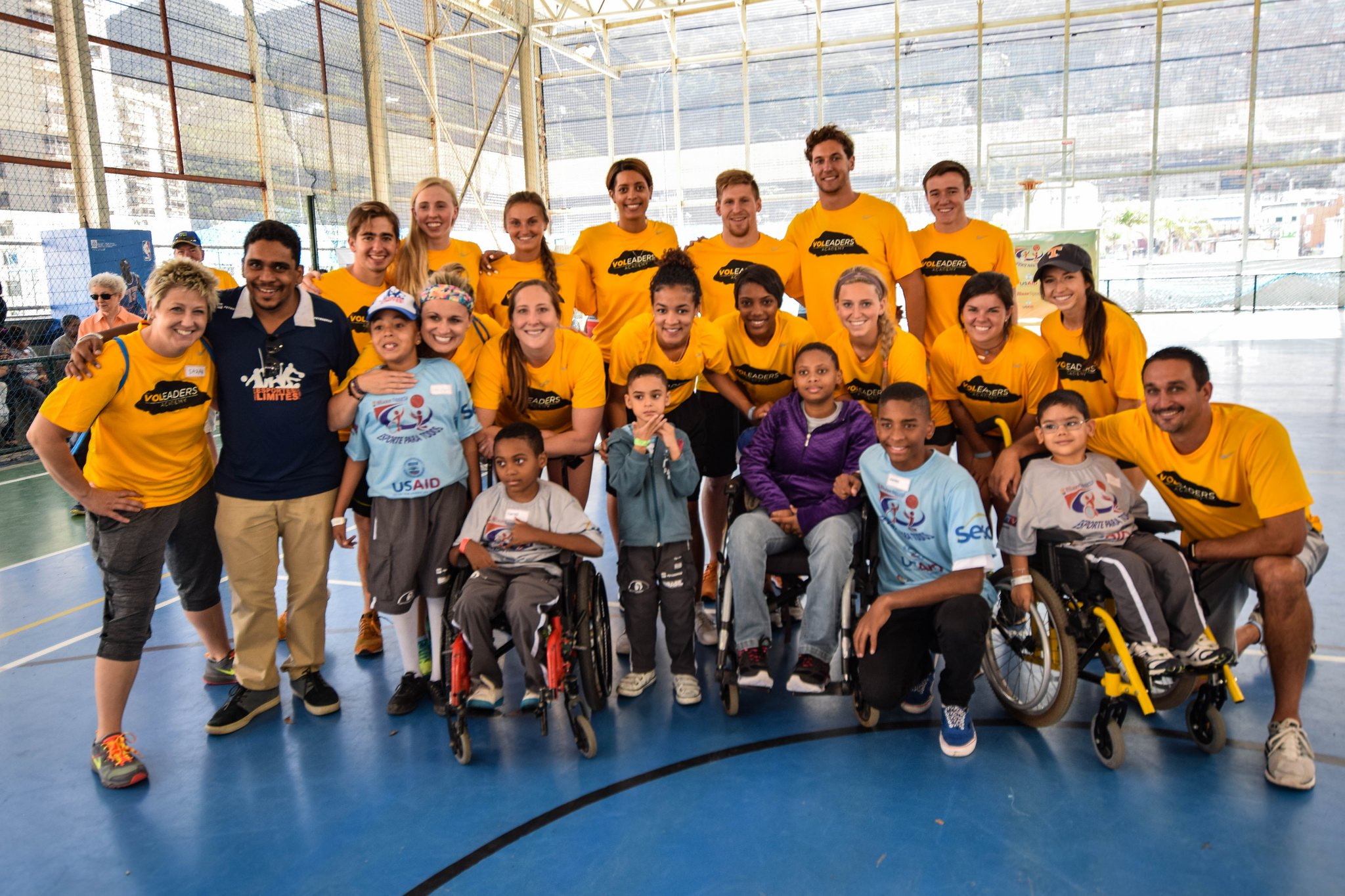 CSPS staff and student-athletes in the 2016 VOLeaders class pose for a photo with participants in an adaptive sports clinic in Rio de Janeiro, Brazil