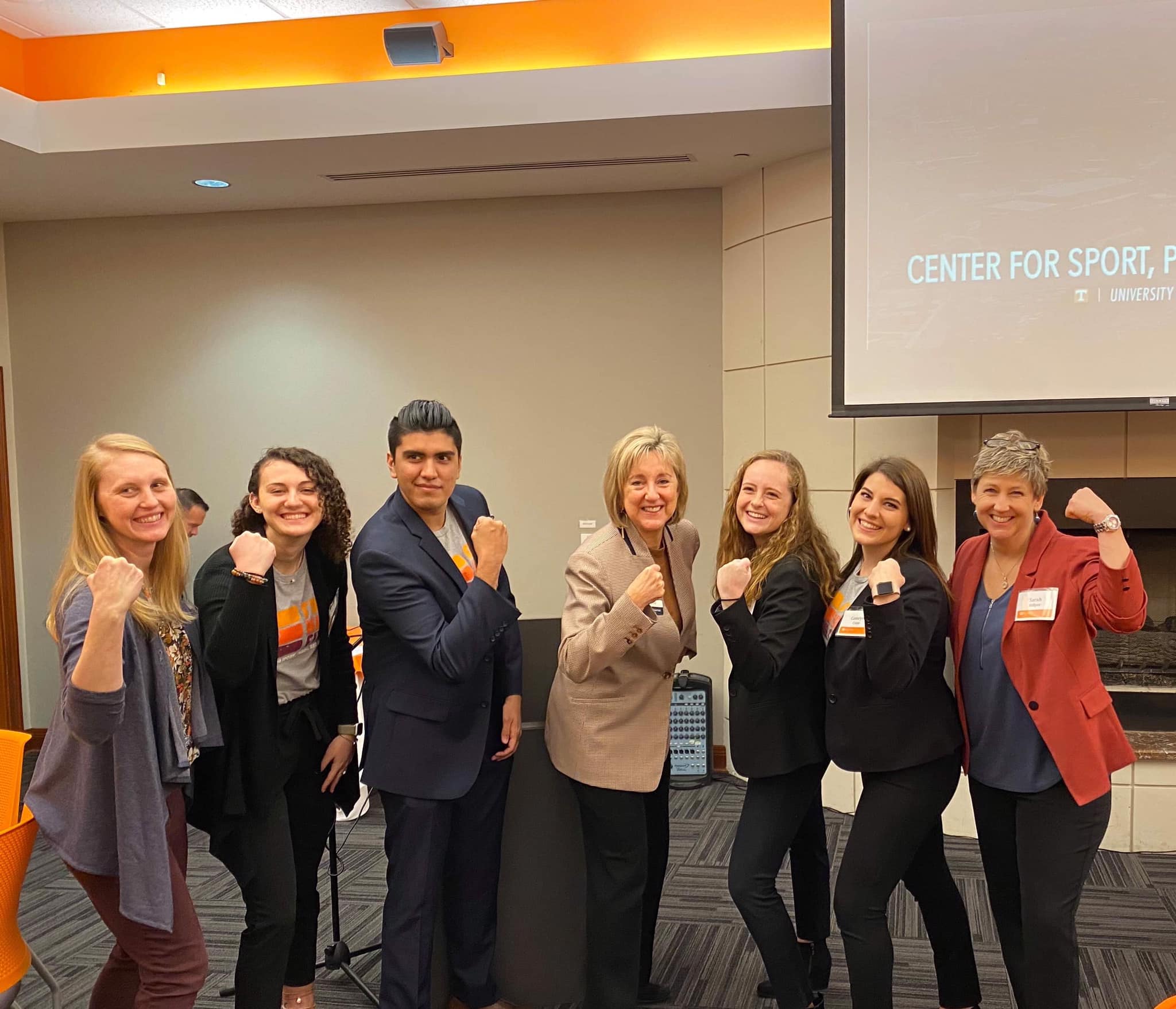 Four CSPS interns, Dr. Carolyn Spellings, and Dr. Sarah Hillyer are standing in a line and "flexing their muscles" with UT Chancellor Donde Plowman following the Chancellor’s Associates Meeting in January 2020.